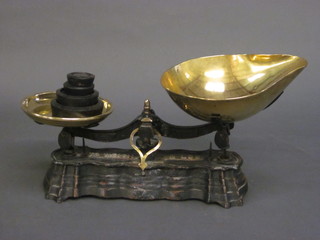 A pair of iron and brass pan scales