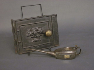 A steel and brass Beraime oil can and an iron stove door 11"