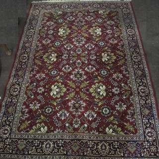 A brown ground and floral pattern machine made Persian style  rug 117" x 80"