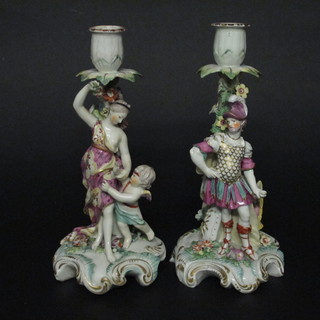 A pair of 19th Century porcelain candlesticks decorated classical lady and gentleman figure, some light restoration, 10"