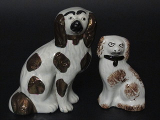 2 19th Century Staffordshire figures of seated Spaniels 6" and 4 1/2"