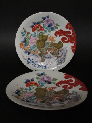 A pair of 19th Century Oriental plates decorated dragons 11", 1 chipped to rim
