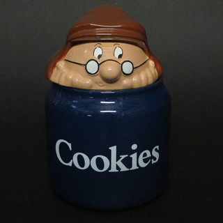 A cylindrical Wade cookie jar decorated a Tetley Tea figure together with various Tetley Tea figures