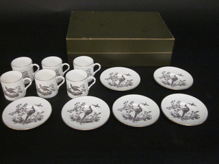 A 12 piece Royal Worcester coffee service decorated birds comprising 6 cups and 6 saucers, contained in a Worcester box