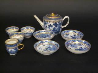 An 18th Century porcelain teapot with strap work handle and chinoiserie decoration together with 3 matching teabowls and  saucers, 1 other saucer and a coffee can