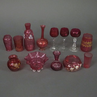 A collection of cranberry and ruby glassware