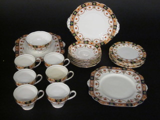 A 22 piece Gladstone China Derby pattern tea service comprising bread plates 9", circular twin handled plate 8", 6 tea plates 6  1/2", sugar bowl, 6 cups - 2 cracked, together with original  1950's bill of sale from G E Hill & Sons of Brighton -6
