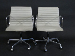 After Charles Eames, a set of 4 chromium plated chairs with  labels Made according to the original design of Charles Eames,