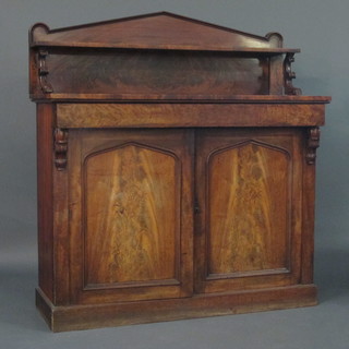 A 19th Century mahogany sideboard with raised back, the base  fitted 1 long drawer above a pair of cupboards enclosed by arch  panelled doors, raised on a platform base 54"   ILLUSTRATED
