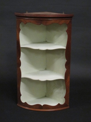 A Queen Anne style walnut hanging open corner cabinet with moulded cornice, fitted shelves, 18"