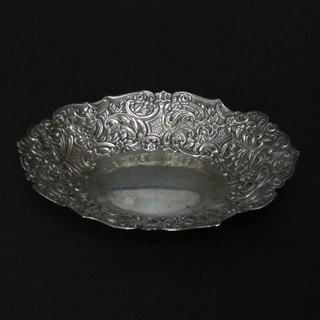 An Edwardian oval embossed silver dish, London 1901, 3 ozs