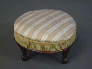 A Victorian circular mahogany footstool raised on cabriole supports 12"