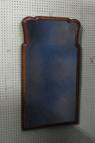 A good quality Queen Anne style shaped bevelled plate wall mirror contained in a walnut frame 18"