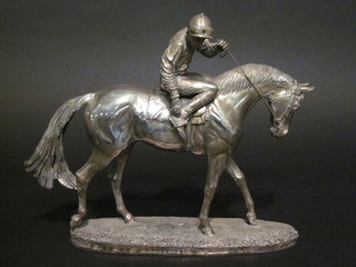 Geenty, a modern silvered racing trophy in the form of a race horse with jockey up, 10"