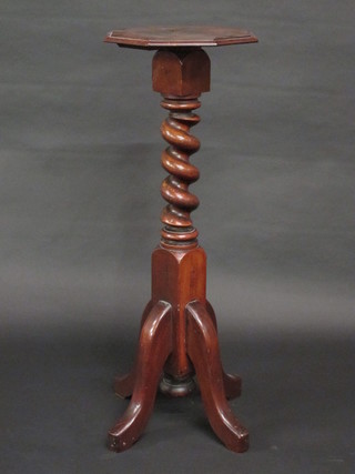 A Victorian turned mahogany bed post torchere with octagonal top