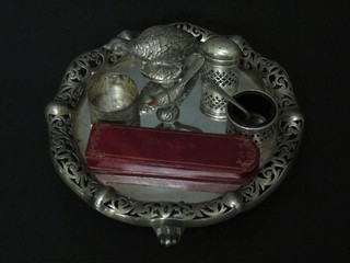 A circular pierced silver plated condiment stand, base f, a 2 piece silver plated salt and pepper, 2 figures of birds, a napkin ring, a  propelling pencil and a thermometer