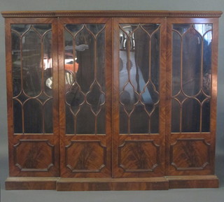 A Maple & Co Georgian style breakfront mahogany bookcase enclosed by astragal glazed panelled doors, raised on a platform  base 73"