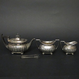 An oval silver plated 3 piece Bachelor's tea service with demi-reeded decoration comprising teapot, cream jug and sugar bowl