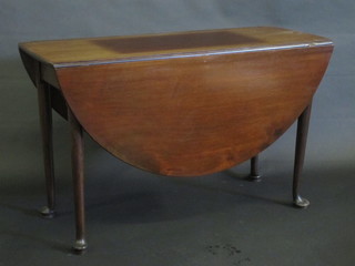 A 19th Century mahogany oval dropflap gateleg dining table,  raised on pad feet 44"