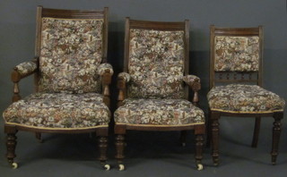 A Victorian 8 piece oak show frame drawing room suite  comprising armchair, nursing chair and 4 standard chairs with  upholstered seats and backs, raised on turned supports