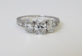 A lady's white gold dress/engagement ring set 3 diamonds,  approx 1.86ct