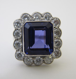 A lady's 18ct white gold dress ring set a square cut tanzanite surrounded by diamonds, approx 2.20/10.20ct   ILLUSTRATED