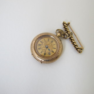 An open faced fob watch contained in a 9ct gold case