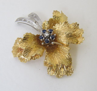 An 18ct gold floral spray brooch set sapphires and diamonds
