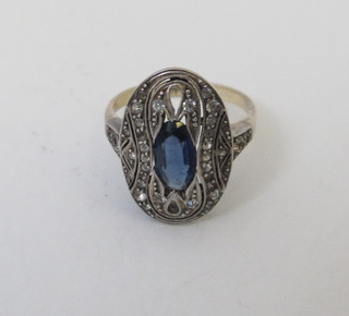 A 9ct gold dress ring set an oval blue stone