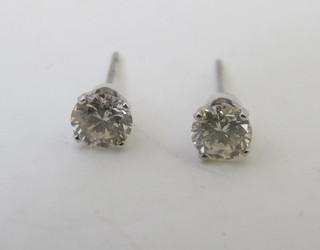 A pair of 14ct white gold diamond set ear studs approx .90ct