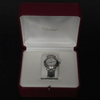 A gentlemans Cartier automatic wristwatch, complete with  original box and papers
