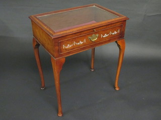 A rectangular inlaid mahogany bijouterie table with hinged lid, raised on cabriole supports 25"