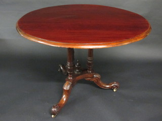 A Victorian oval mahogany tea table raised on 3 turned columns  with triform base and splayed feet 40"
