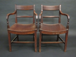 A pair of 19th Century mahogany bar back chairs with solid  seats, raised on square tapering supports with H framed stretcher