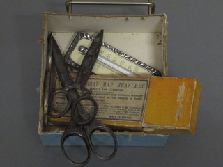 A silver cased thermometer, 3 pairs of vintage scissors and a Universal map measurer