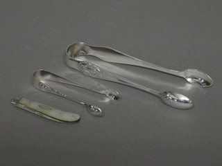 A Victorian silver bladed fruit knife with mother of pearl grip together with 2 pairs of silver plated sugar tongs