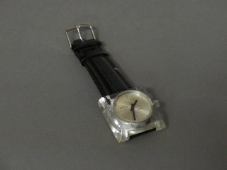 A Buler wristwatch contained in a square plastic case
