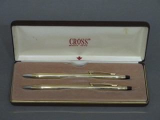 A Cross gold plated ballpoint pen together with a do. propelling pencil