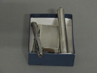 A silver match slip by Aspreys, a silver thimble, a silver cigarette  holder case, a silver propelling pencil and a white metal needle  case