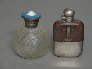 An Edwardian globular cut glass scent bottle with blue enamelled  and silver lid together with a hip flask