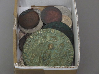 A collection of various coins and medallions