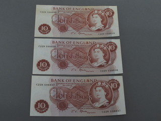 3 red 10 shilling notes