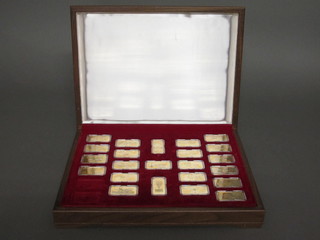 23 various gilt metal ingots - Milestones of Manned Flight, contained in a teak box
