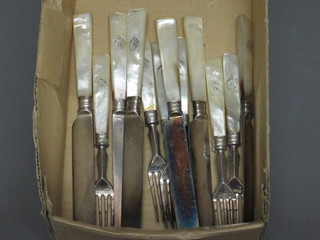 A set of 6 Victorian silver plated fruit knives and forks with mother of pearl handles