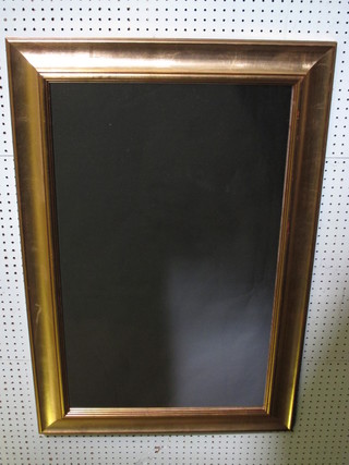 A rectangular plate wall mirror contained in a decorative gilt  frame 38" 30-50
