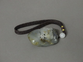 A carved "jade" pendant decorated a tiger fish 2"