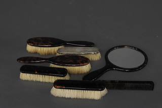 A silver backed hair brush together with a 6 piece tortoiseshell finished dressing table set with pair of hair brushes, pair of  clothes brushes and a hand mirror