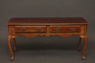 An American style cherry side table with crossbanded top fitted 2 drawers, raised on cabriole supports 51"