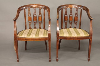 A pair of Edwardian inlaid mahogany tub back open chairs raised  on square tapering supports ending in spade feet