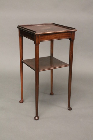 A 19th Century mahogany 2 tier bedside table with three-quarter gallery, raised on club supports 15"